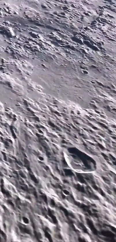 High-resolution lunar surface with craters for phone wallpaper.