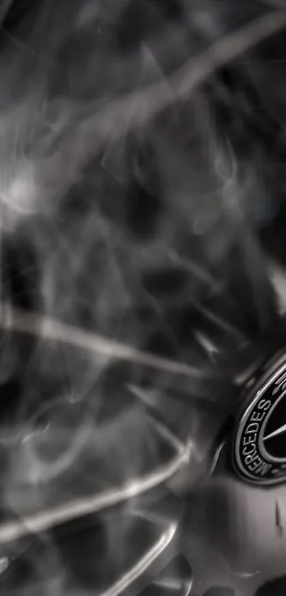 Close-up of a luxurious car wheel with dark, sleek design.