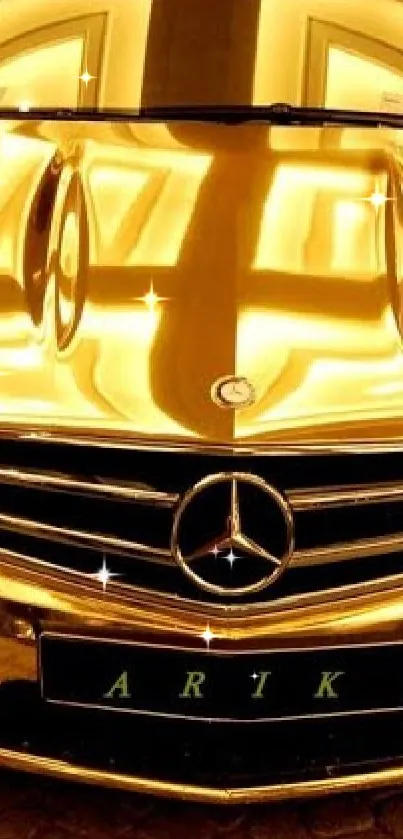 Luxurious gold car with gleaming details on cobblestone pavement.