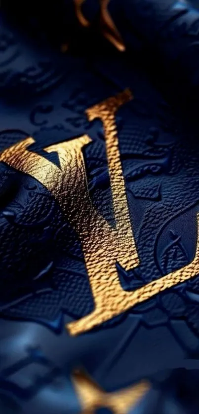 Luxurious gold monogram on blue leather background.