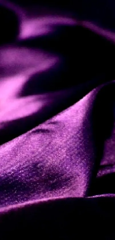 Luxurious purple fabric texture wallpaper for smartphones.