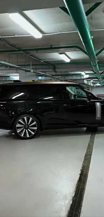 Luxurious black SUV parked in a modern underground garage.