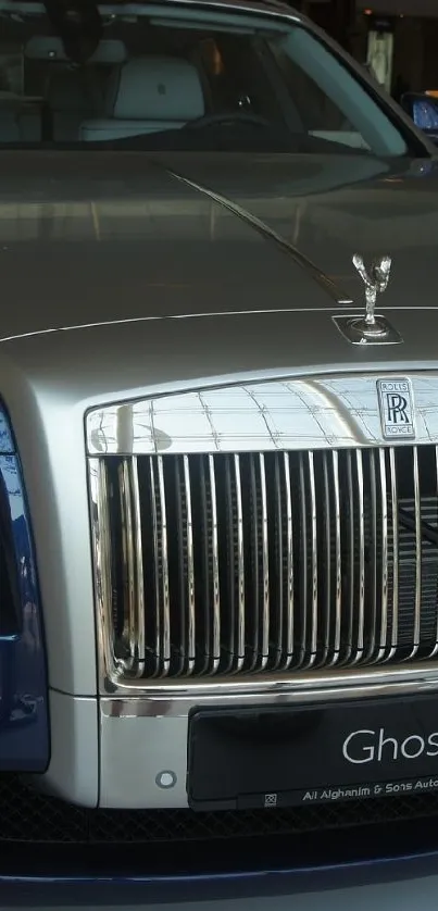 Front view of a luxury blue car showcasing elegance and style.