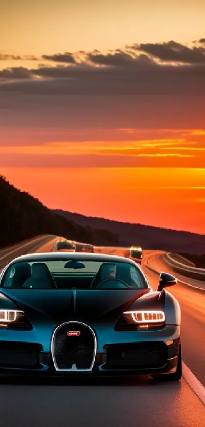 Luxury car driving on an open road with a vibrant sunset in the background.