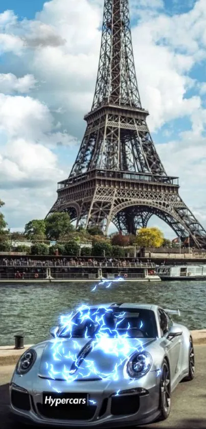 Silver luxury car by Eiffel Tower under a bright blue sky.