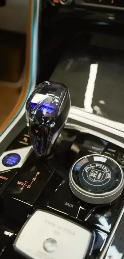 Close-up of luxury car's gear shift and control panel.