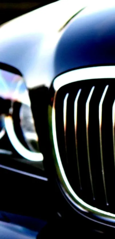 Close-up of luxury car grille and headlight.