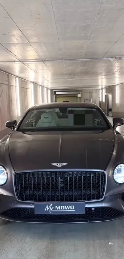 Luxury car parked in a modern tunnel setting.