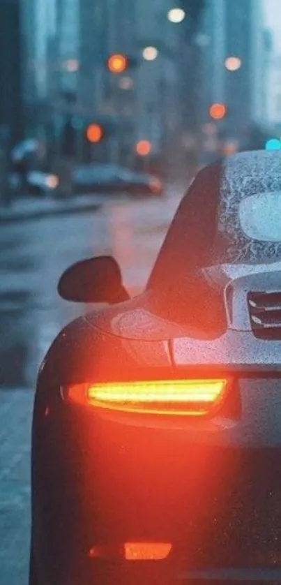 Luxury car with glowing tail lights in rainy cityscape.