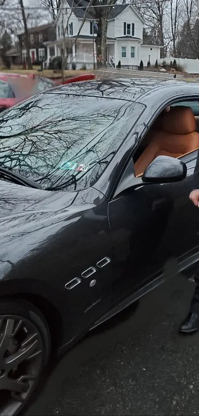 Luxury car parked on suburban street with sleek design and elegance.