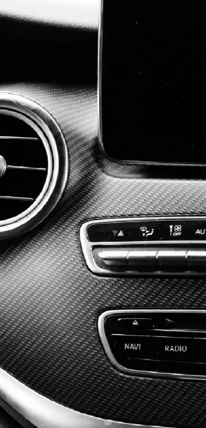 Luxury car interior in black and white, emphasizing sleek design elements.