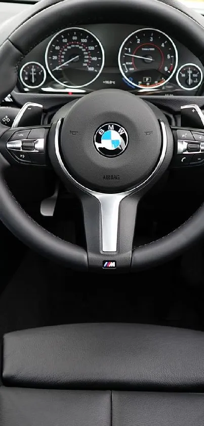 Luxury car interior with steering wheel and dashboard view.