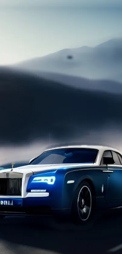 Blue luxury car on a misty night road with mountains in background.