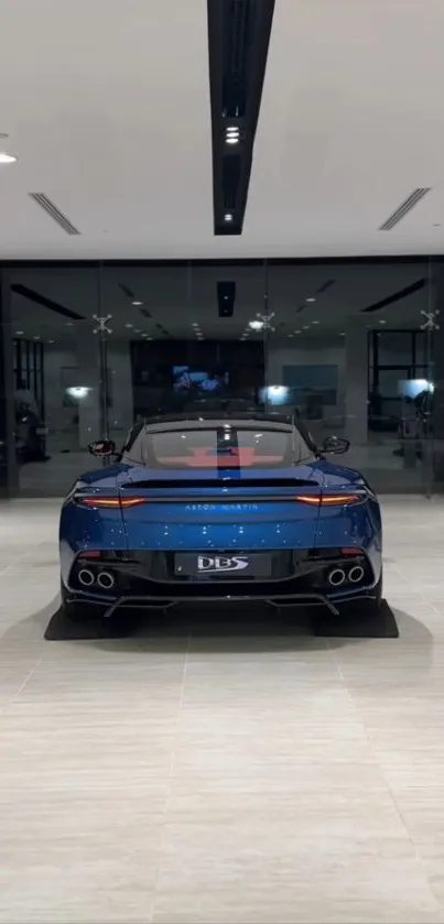 Rear view of a luxury blue car in a showroom setting.