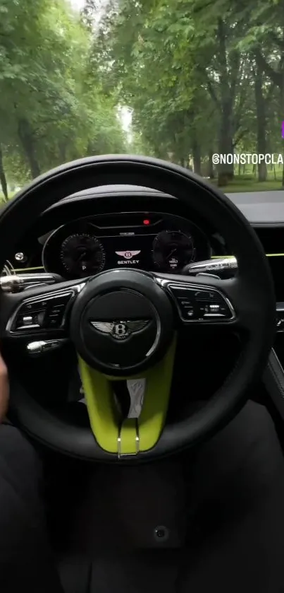 Luxury Bentley steering wheel with green backdrop.