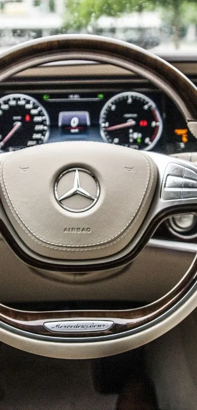 Luxury car steering wheel and dashboard in elegant beige tones.