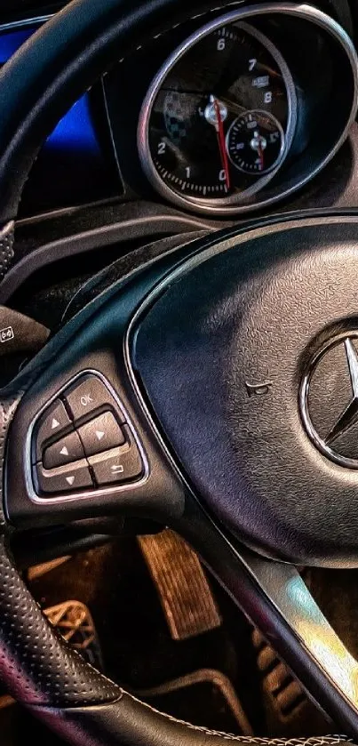 Close-up of a luxury car steering wheel with intricate details.