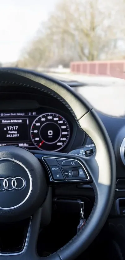 Luxury car dashboard showcasing sleek design and steering wheel.