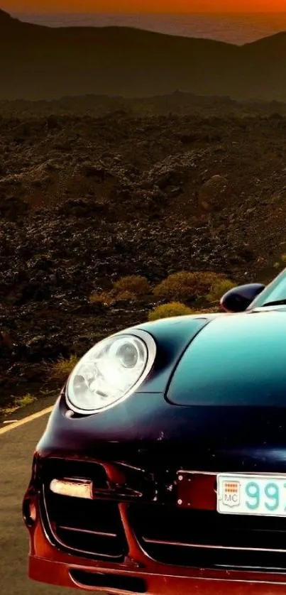 Luxury sports car on road at sunset with mountains in the background.