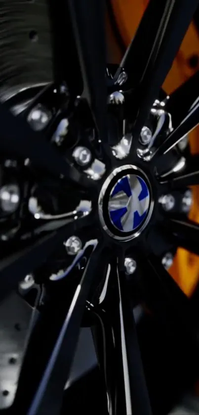 Close-up of luxury car wheel with intricate design and black finish.