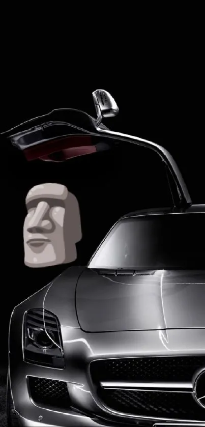 Luxury car with raised door and an Easter Island statue.