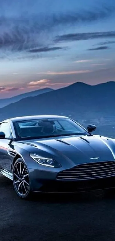 Luxury sports car in front of mountains at sunset.