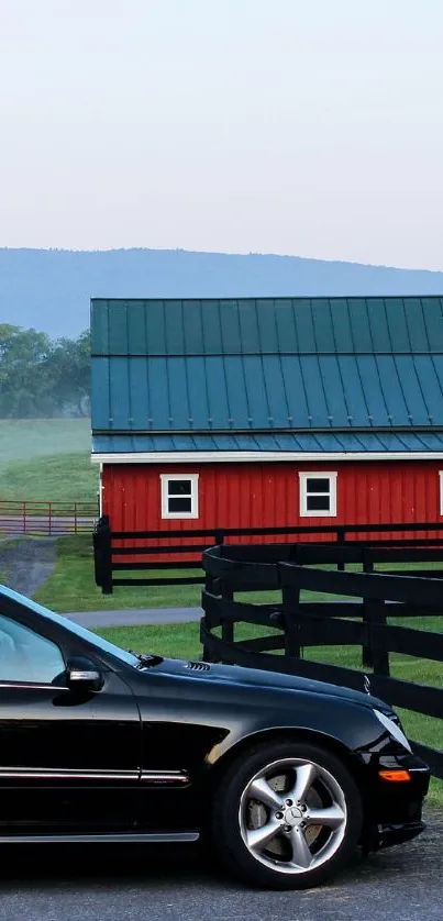 Luxury black car in front of a barn with green landscape and serene background.