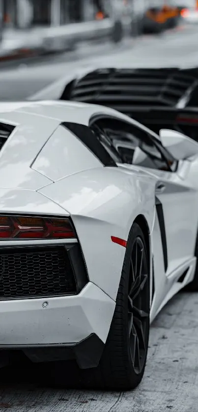 Luxury sports cars parked in an urban setting