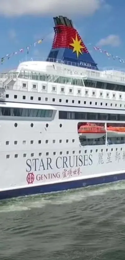 Luxurious cruise ship sailing on the ocean with a clear blue sky.