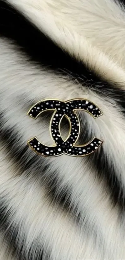 Black and white faux fur with monogram logo.