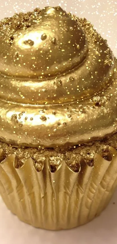 A luxurious golden cupcake with a rich, shiny texture for mobile wallpaper.