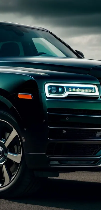 Luxurious dark green car with sleek design on the road.