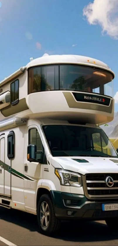 Luxury motorhome on scenic road with mountains and blue sky.