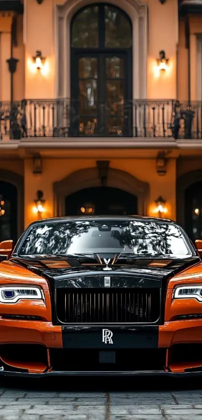 Orange Rolls-Royce parked in a luxurious driveway, showcasing elegance and style.