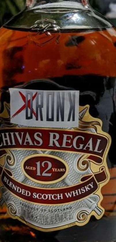 Mobile wallpaper of Chivas Regal 12-year-old Scotch whisky bottle.