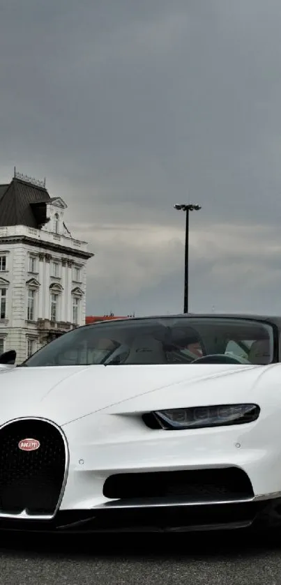 White sports car against city architecture.