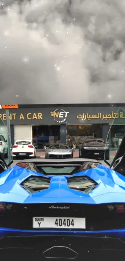 Luxury blue sports car in front of elegant car rental shop.