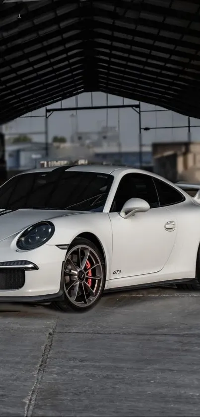 White sports car parked in a modern urban setting.