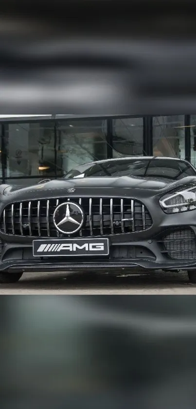 Sleek black sports car with AMG design parked outside.