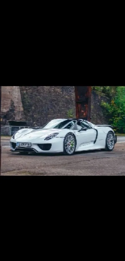 Luxury sports car in urban setting wallpaper.
