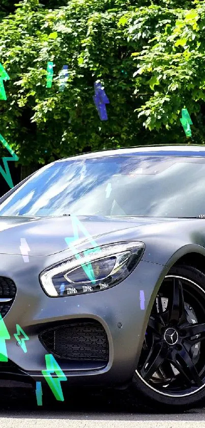 Sleek grey Mercedes AMG sports car under green trees in nature.