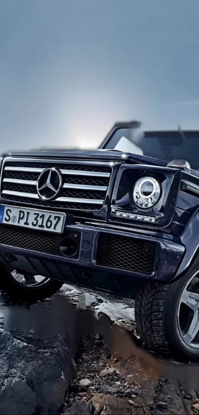 Luxury SUV navigating rocky terrain under a moody sky.