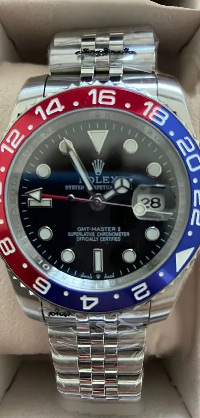 Luxury watch with silver and blue details.