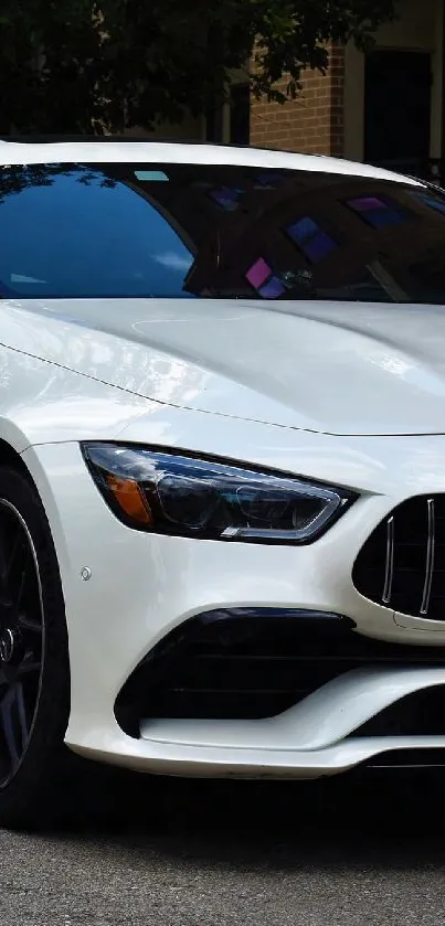 Luxury white car parked on urban street.