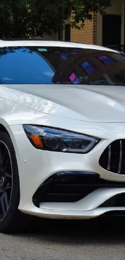 Luxury white car parked on an urban street.