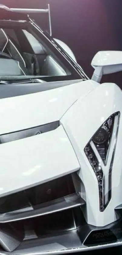 Sleek white luxury sports car in showroom lighting.