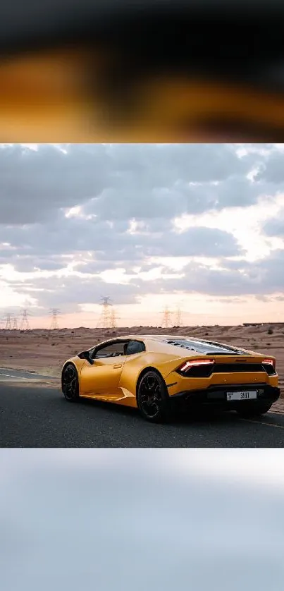 Yellow sports car on a desert road under a cloudy sky.