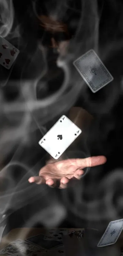 Hand casting floating playing cards with smoke effect.