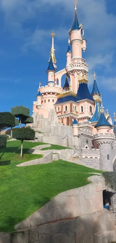 Majestic castle on a green hill under a blue sky.