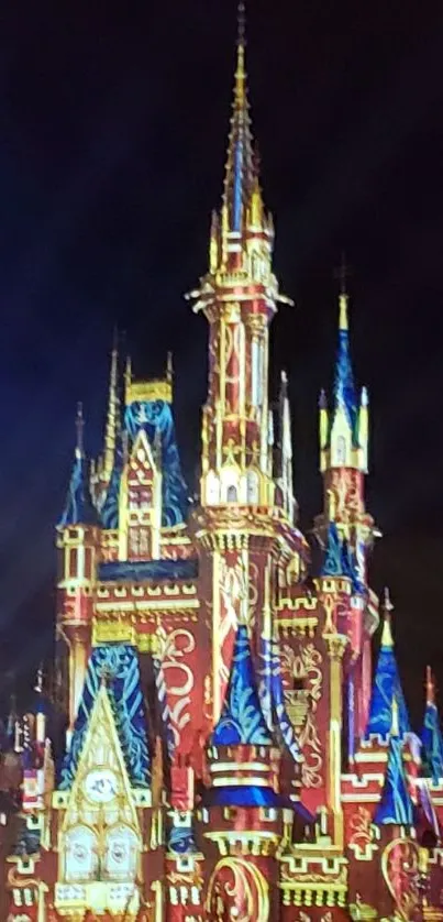 Illuminated castle towers under a dark sky.